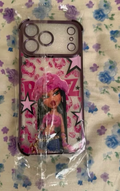 Pink Bratz phone case with fashion-doll character, stars, and lip-print graphics